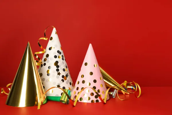Party Hats Festive Items Red Background Space Text — Stock Photo, Image
