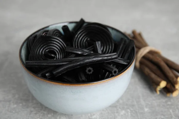 Tasty Black Candies Dried Sticks Liquorice Root Grey Table — Stock Photo, Image