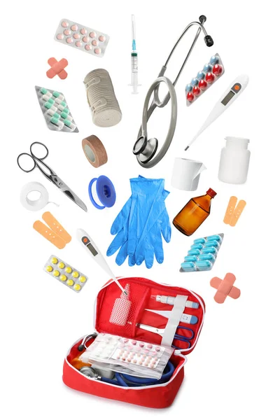 First Aid Kit Different Medical Supplies Falling White Background — Stock Photo, Image