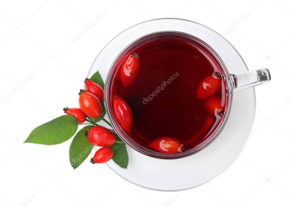 Aromatic rose hip tea and fresh berries on white background, top view