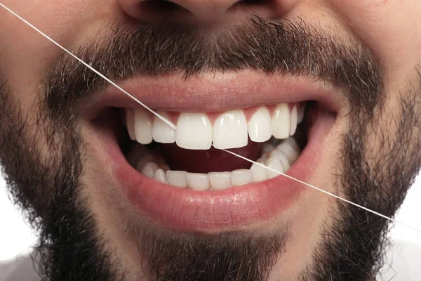 Man Flossing His Teeth White Background Closeup Dental Care — Stock Photo, Image