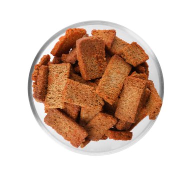 Crispy rusks in bowl isolated on white, top view clipart