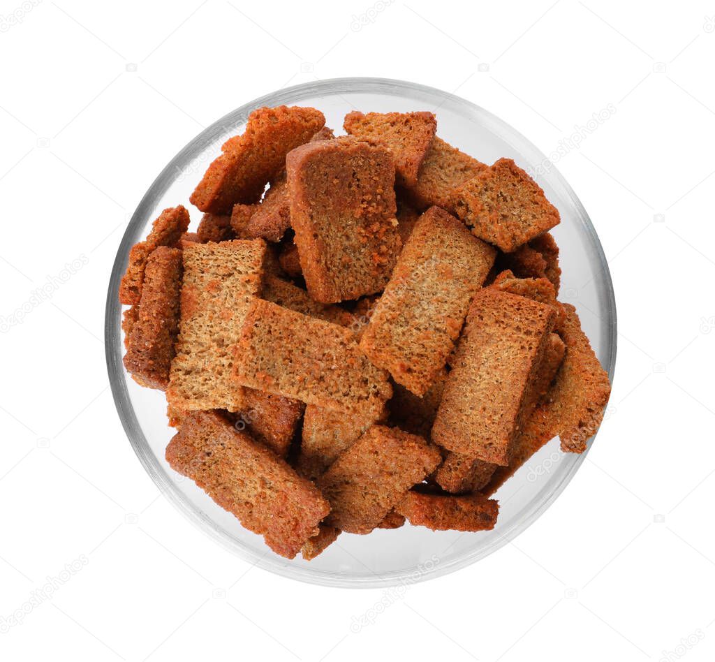 Crispy rusks in bowl isolated on white, top view