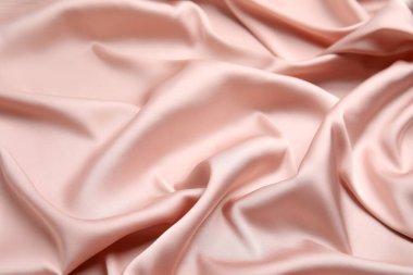 Arkaplan olarak narin pembe ipeğin dokusu, yakın plan