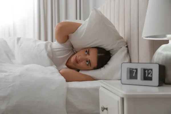 Unhappy Young Woman Covering Ears Pillow Bed Home Noisy Neighbours — Stock Photo, Image