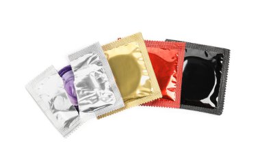 Condom packages on white background, top view. Safe sex clipart