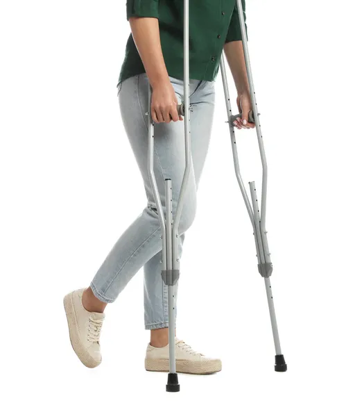 Woman Crutches White Background Closeup — Stock Photo, Image