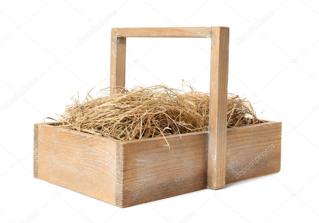 Dried hay in wooden basket on white background