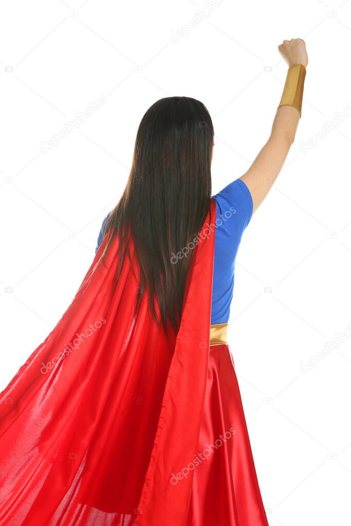 Confident young woman wearing superhero costume on white background, back view
