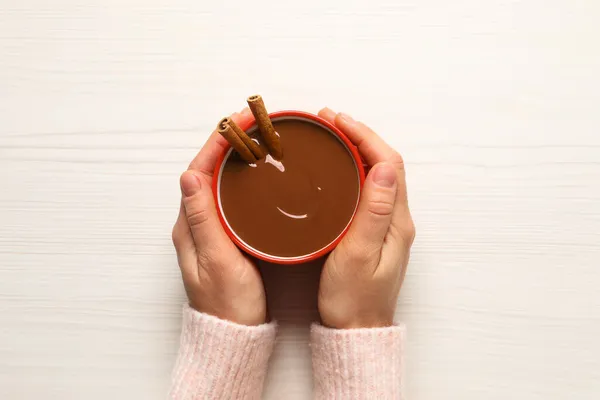 Woman Holding Cup Yummy Hot Chocolate Cinnamon White Wooden Table — Stock Photo, Image