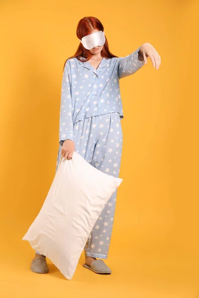 Young Woman Wearing Pajamas Slippers Pillow Sleepwalking State Yellow Background — Stock Photo, Image