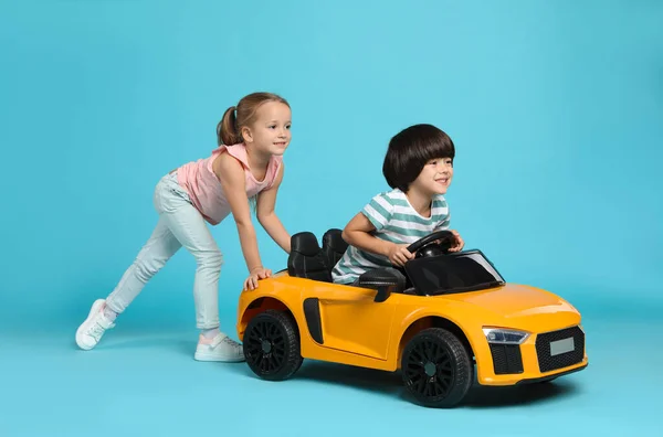 Cute Girl Pushing Children Electric Toy Car Little Boy Light — Stock Photo, Image