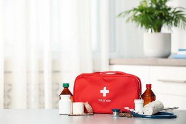 First aid kit on table indoors, space for text clipart