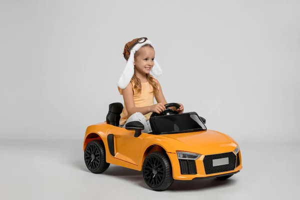 Cute Little Girl Pilot Hat Driving Children Electric Toy Car — Stock Photo, Image