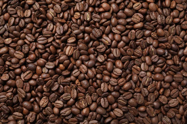 Stapel Van Gebrande Koffiebonen Als Achtergrond Bovenaanzicht — Stockfoto