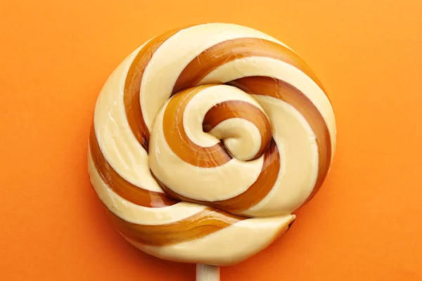 Sweet Colorful Lollipop Orange Background Top View — Stock Photo, Image