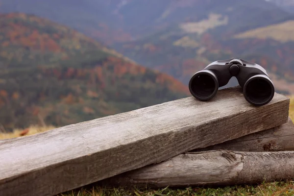 Binoculars Wooden Fence Mountains Space Text — Stock Photo, Image
