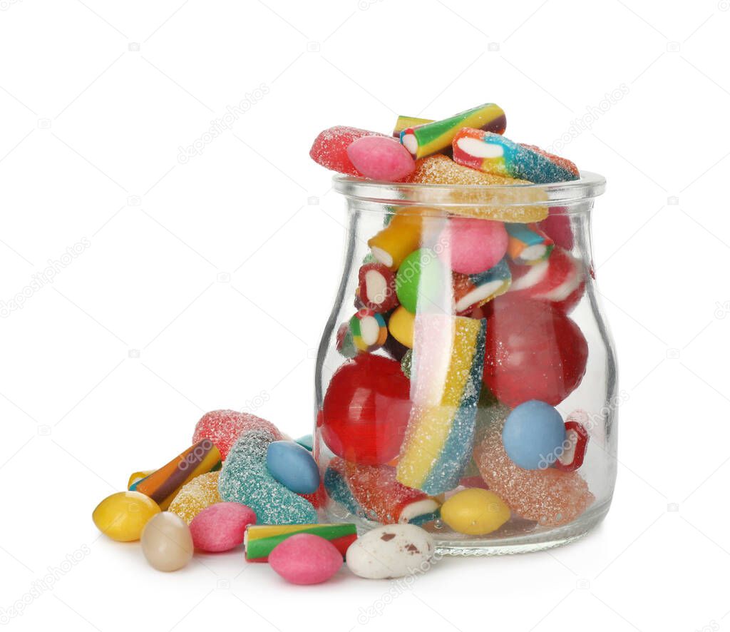 Glass jar with different candies on white background