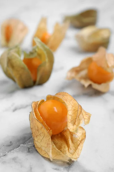 Ripe Physalis Fruits Dry Husk White Marble Table Closeup — Stock Photo, Image