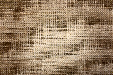 Arka plan olarak doğal çuval bezi dokusu, üst görünüm. Vignette etkisi 