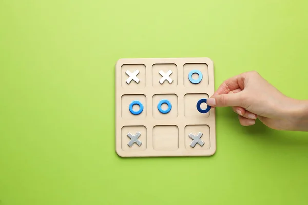 Woman Playing Tic Tac Toe Game Light Green Background Top — Stock Photo, Image