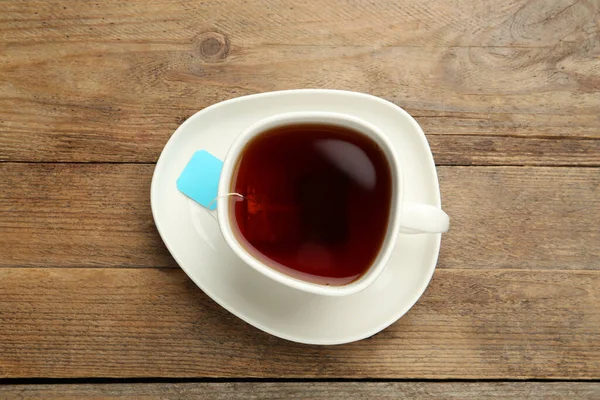 Tea Zsák Kerámia Csésze Forró Víz Fából Készült Asztalon Felülnézet — Stock Fotó