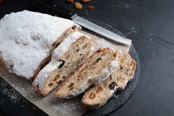 Traditional Christmas Stollen Icing Sugar Black Table — Stock Photo, Image