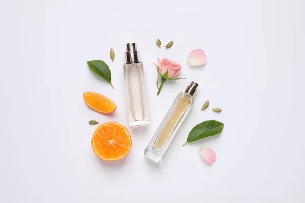 Flat Lay Composition Bottles Perfume Beautiful Flower Tangerine White Background — Stock Photo, Image