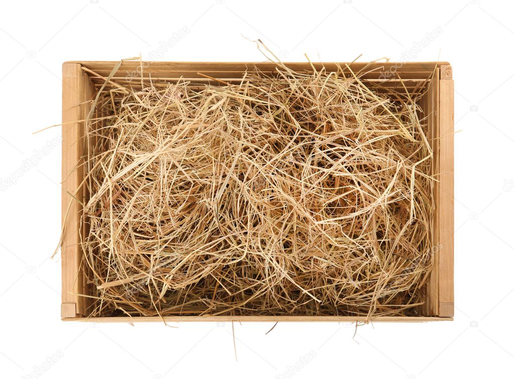 Dried hay in wooden crate on white background, top view