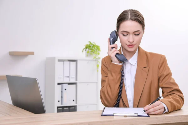 Female Receptionist Clipboard Talking Phone Workplace Space Text — Stock Photo, Image