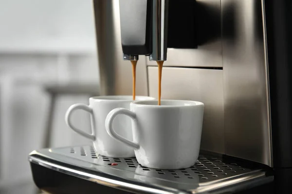 https://st.depositphotos.com/16122460/53524/i/450/depositphotos_535245022-stock-photo-espresso-machine-pouring-coffee-cups.jpg