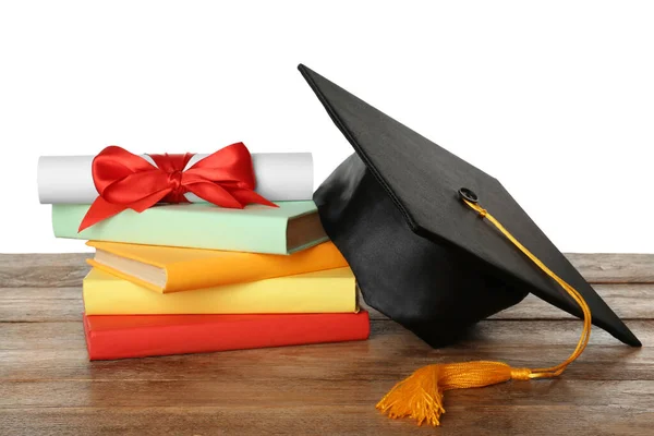 Afstudeerhoed Boeken Diploma Houten Tafel Tegen Witte Achtergrond — Stockfoto