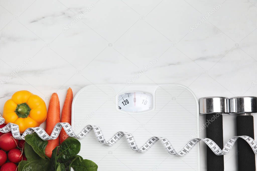 Flat lay composition with scales and vegetables on white marble table, space for text