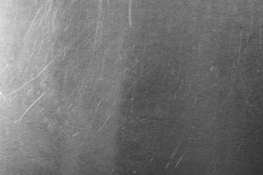 Arka planda çizikler olan eski metal yüzey, yakın plan.