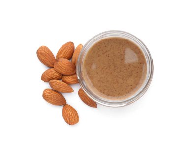 Jar with delicious almond butter and nuts on white background, top view clipart