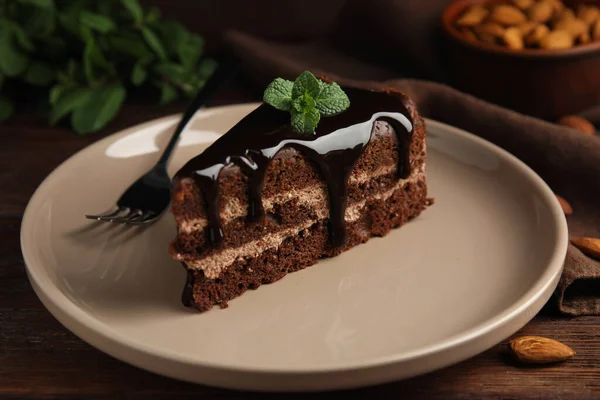 Piece Tasty Homemade Chocolate Cake Mint Wooden Table Closeup — Stock Photo, Image