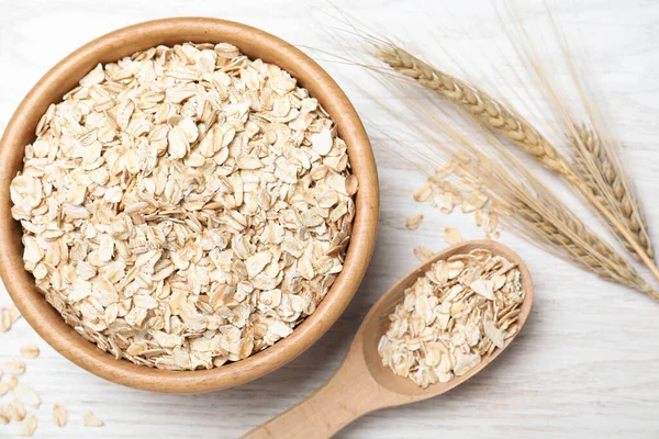 Harina Avena Tazón Cuchara Espiguillas Mesa Madera Blanca Puesta Plana —  Fotos de Stock