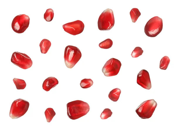 Ripe Juicy Pomegranate Seeds Falling White Background — Stock Photo, Image