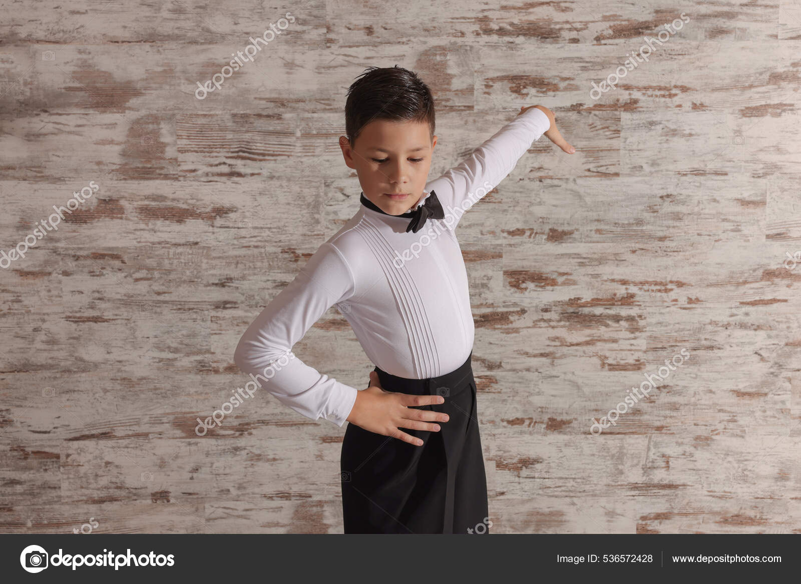 Beautifully Dressed Little Boy Dancing Studio Stock Photo by ©NewAfrica