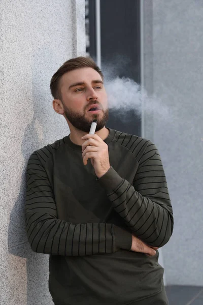 Handsome Young Man Using Disposable Electronic Cigarette Outdoors — Stock Photo, Image