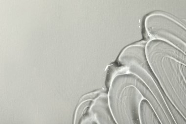 Işıklı arka planda kozmetik jel, üst manzara. Metin için boşluk