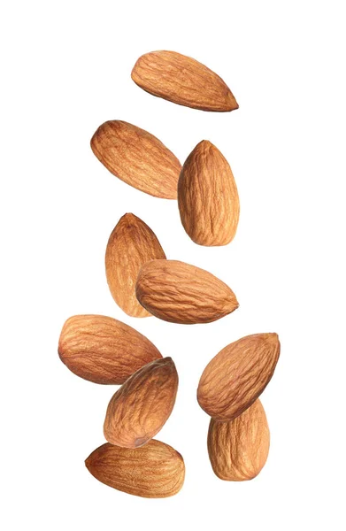 Many Tasty Almonds Falling White Background — Stock Photo, Image