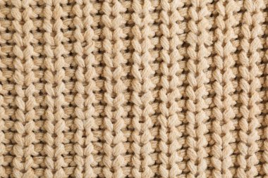 Arka plan olarak güzel bej örülmüş kumaş, üst görünüm