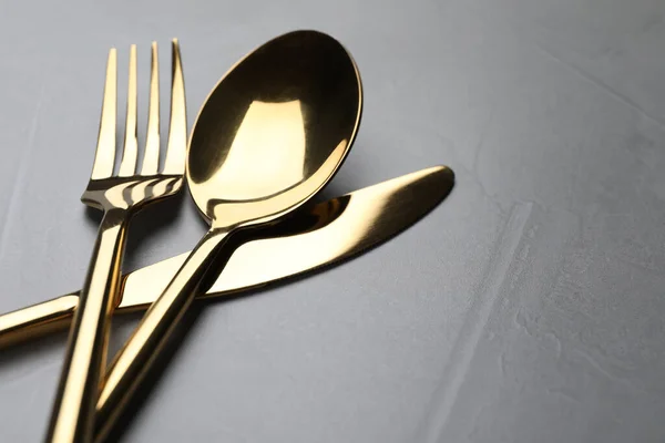Golden Cutlery Grey Table Closeup Space Text — Stock Photo, Image