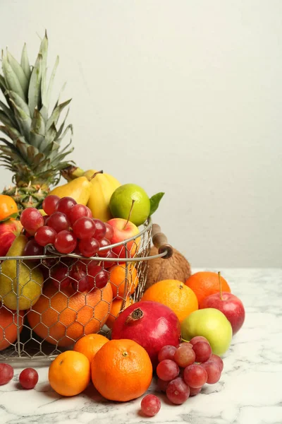 Metal Basket Different Fresh Fruits White Marble Table — Stockfoto