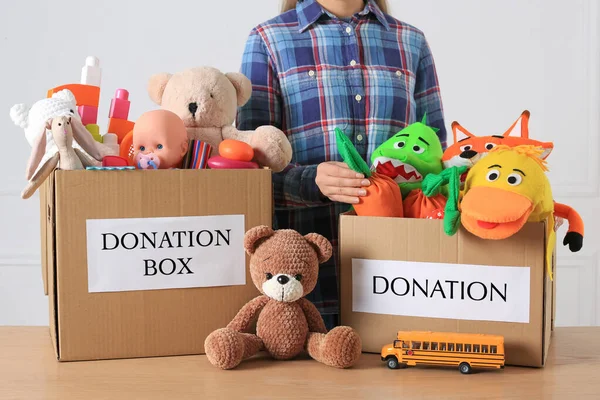 Little Boy Donation Boxes Toys Light Background Closeup — 图库照片