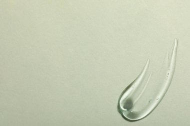 Işık arka planında kozmetik jel örneği, üst görünüm. Metin için boşluk