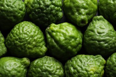 Arka plan olarak taze bergamot meyveleri, üst görünüm