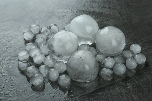 Many Melting Ice Balls Dark Grey Table — Stock Photo, Image