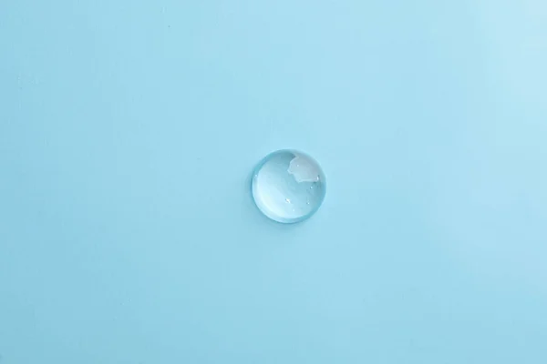 Drop Transparent Ointment Light Blue Background Top View — Foto Stock